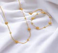 Set de joyas colalr de cuentas flores y circonita y puplsera a juego de acero inoxidable oro 18K PVD waterproof
